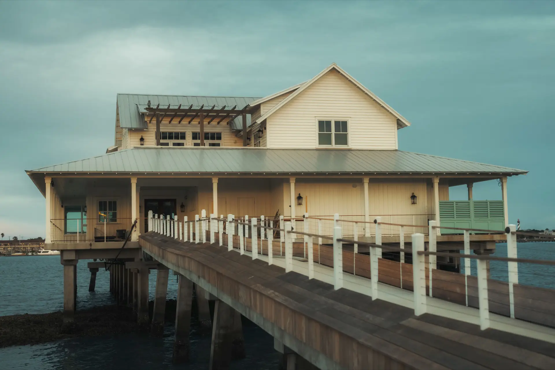 Waterfront home with a dock at golden hour