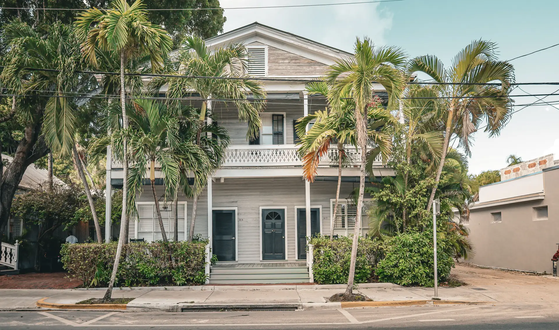 Two-story Florida home with palm trees