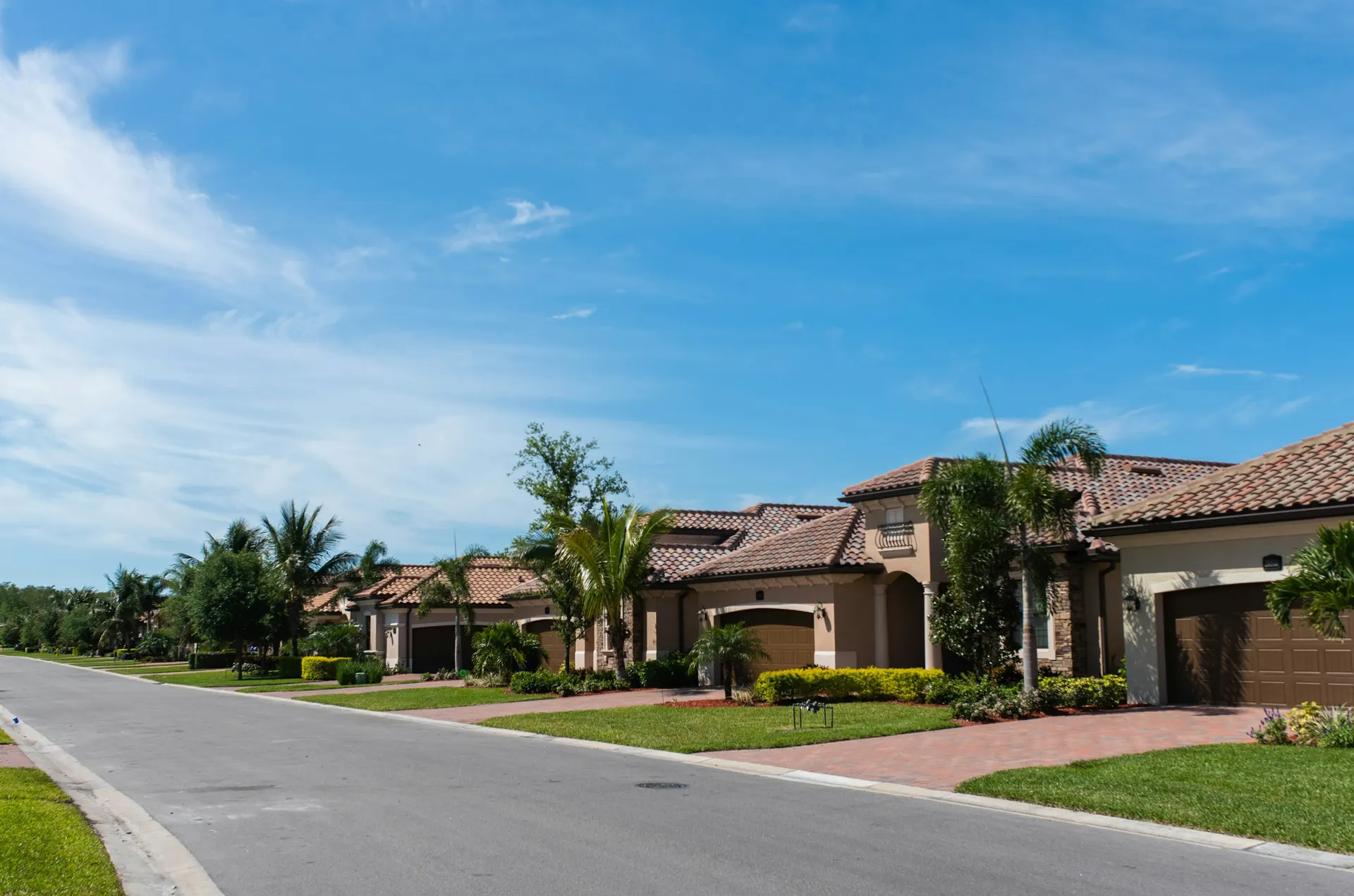 Florida neighborhood street with tile-roof homes