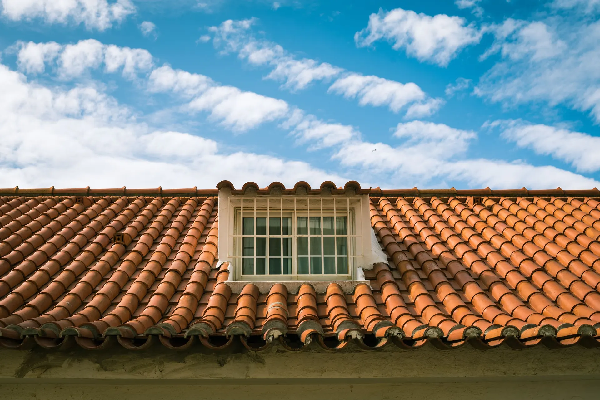 Clay tile roof with a dormer window